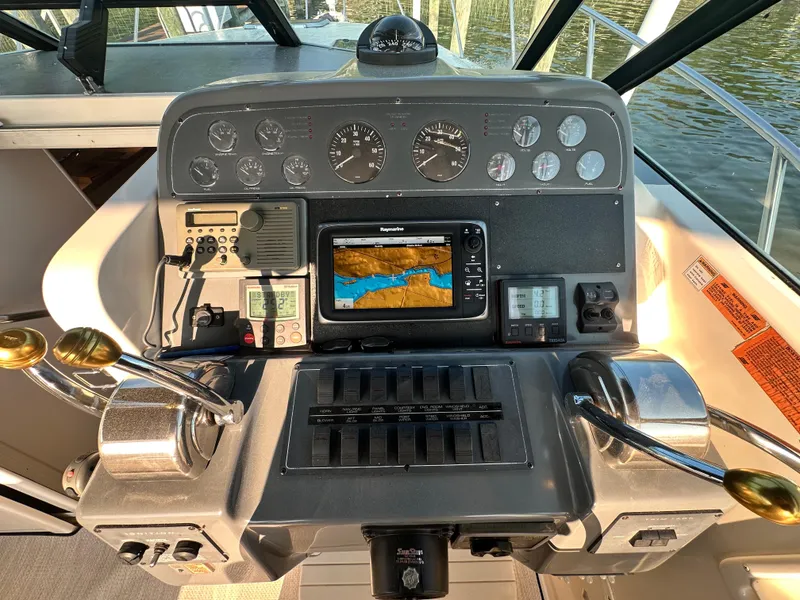 Slide: The Image of Control panel of a 1997 Tiara Yachts 3100 Open with navigation equipment. - 11