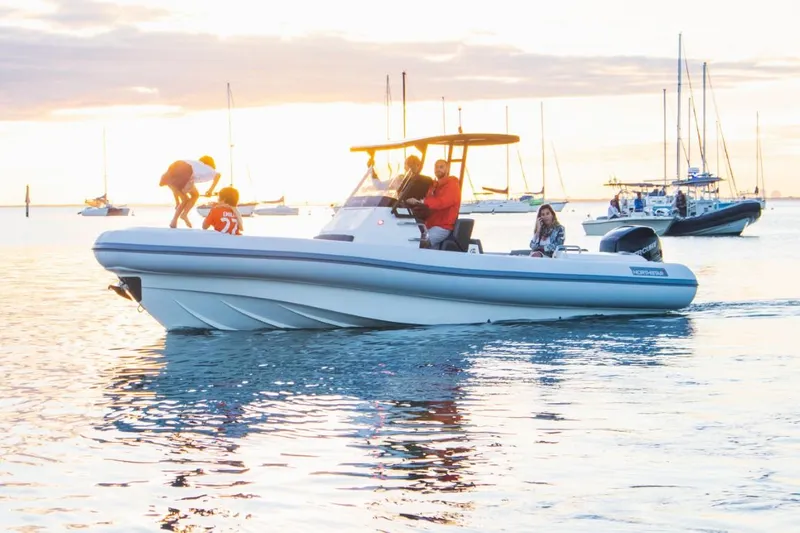 Slide: The Image of 2024 Northstar Orion 8 boat cruising at sunset with passengers. - 17