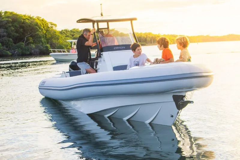 Slide: The Image of 2024 Northstar Orion 8 boat with passengers enjoying a sunny day on the water. - 13