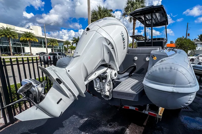 Slide: The Image of 2024 Northstar Orion 8 boat with Yamaha outboard motor, parked outdoors under a blue sky. - 5