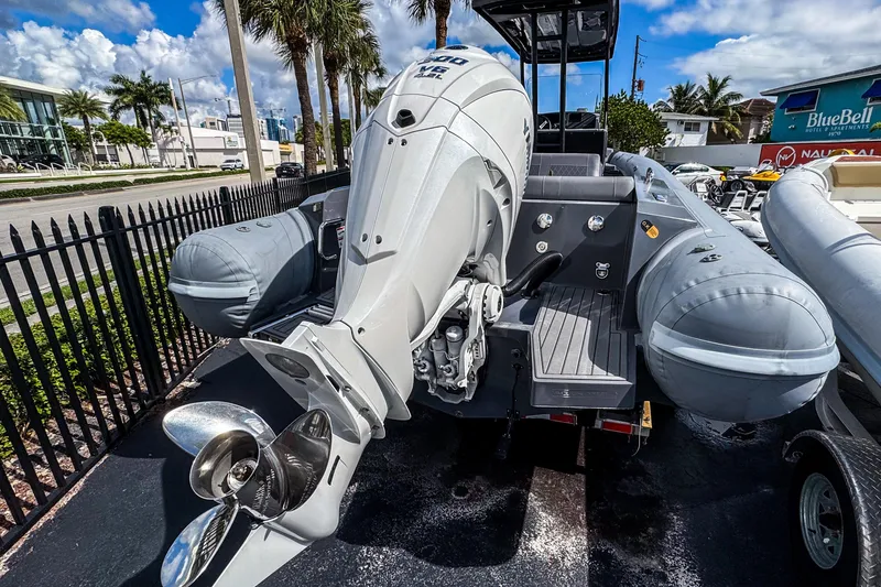 Slide: The Image of 2024 Northstar Orion 8 boat with powerful outboard motor, docked under sunny skies. - 6