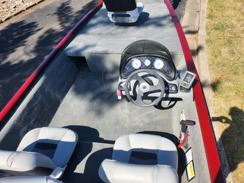 Slide: The Image of 2018 Tracker Pro 170 boat interior with steering wheel and seats. - 10