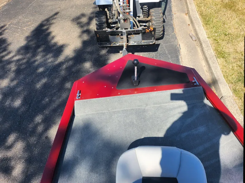 Slide: The Image of 2018 Tracker Pro 170 boat being towed by a vehicle on a sunny day. - 15