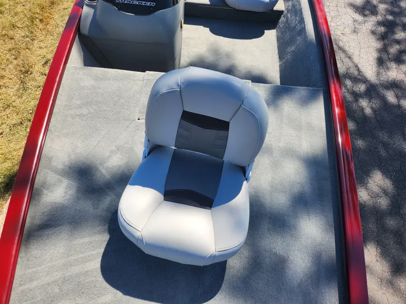 Slide: The Image of 2018 Tracker Pro 170 boat interior with gray seating and red trim. - 16