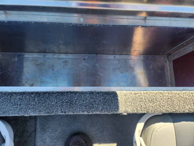 Slide: The Image of Interior view of a 2018 Tracker Pro 170 boat showing storage compartment. - 21