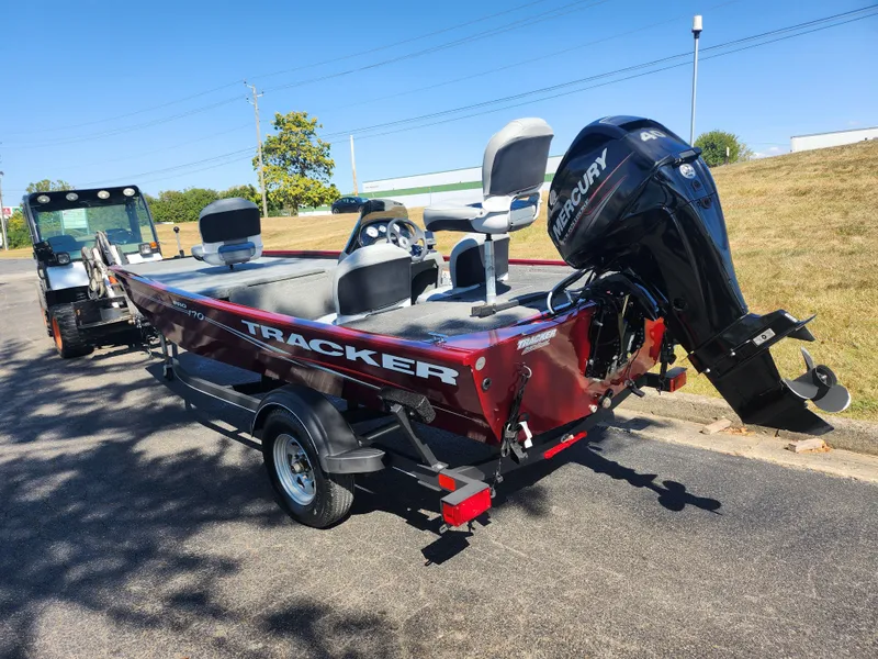 Slide: The Image of 2018 Tracker Pro 170 boat with Mercury engine on trailer, parked outdoors. - 3