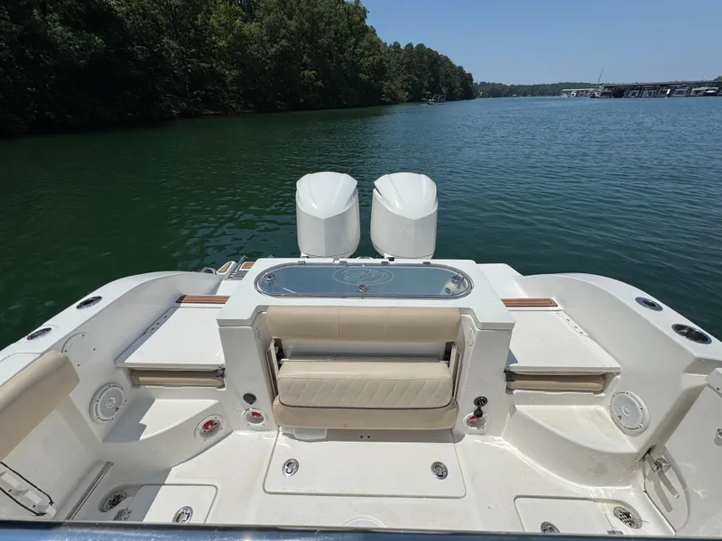 Slide: The Image of 2017 Sea Fox 288 Commander boat with dual engines on a serene lake. - 16
