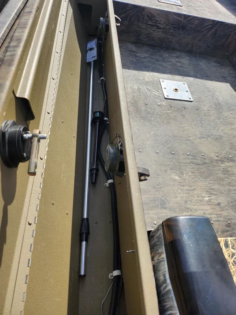 Slide: The Image of 2019 G3 Gator Tough 15 DK boat interior, showing storage compartment and equipment. - 11