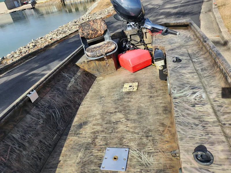 Slide: The Image of 2019 G3 Gator Tough 15 DK boat with camo seats and outboard motor. - 16