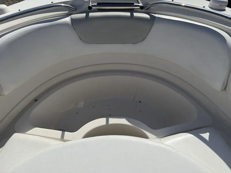 Slide: The Image of 2007 Chaparral 276 SSX boat interior, featuring white seating and stainless steel railings. - 15