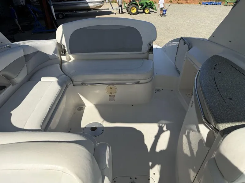 Slide: The Image of 2007 Chaparral 276 SSX boat interior with white seating and spacious layout. - 20