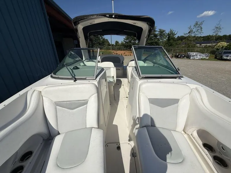 Slide: The Image of 2007 Chaparral 276 SSX boat interior with white seating and open cockpit. - 28