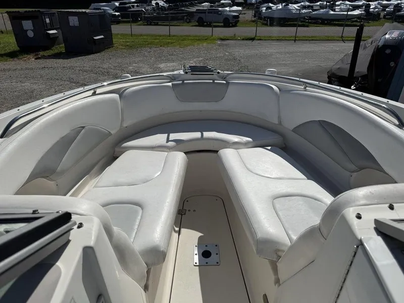 Slide: The Image of 2007 Chaparral 276 SSX boat interior with white cushioned seating. - 3