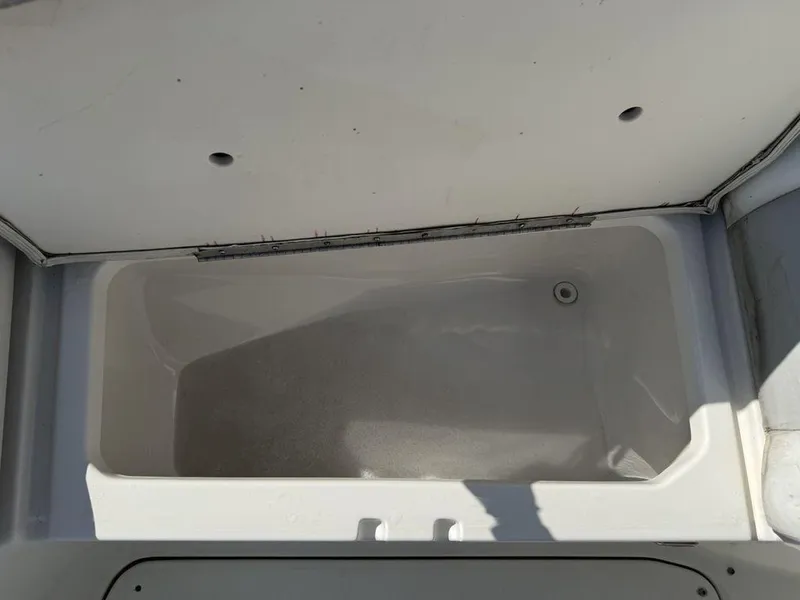Slide: The Image of Open storage compartment on a 2007 Chaparral 276 SSX boat. - 7