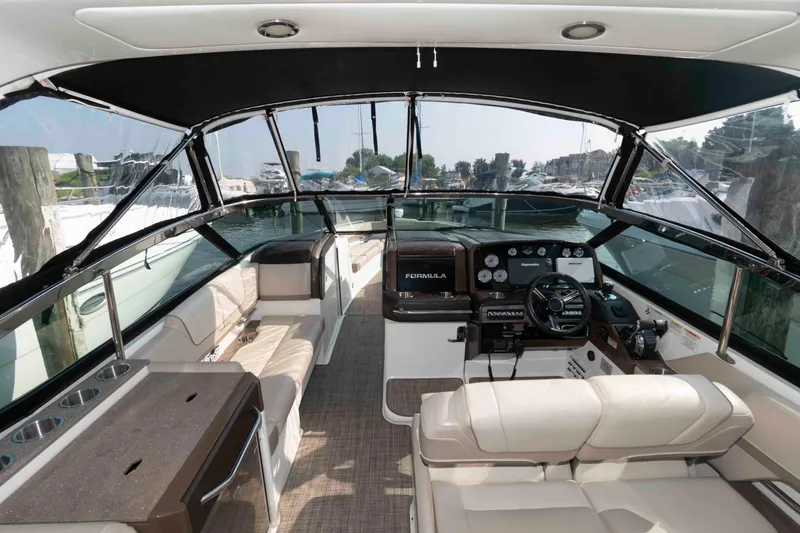 Slide: The Image of 2016 Formula 330 Crossover Bowrider interior with luxurious seating and modern dashboard. - 17
