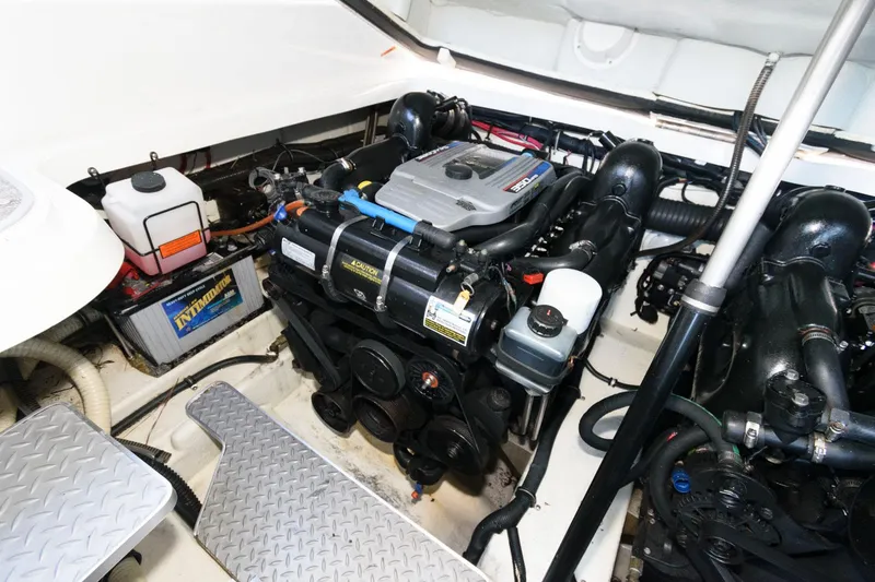 Slide: The Image of Engine compartment of a 2016 Formula 330 Crossover Bowrider, showcasing detailed mechanical components. - 24
