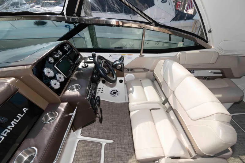 Slide: The Image of 2016 Formula 330 Crossover Bowrider interior with sleek dashboard and comfortable seating. - 9