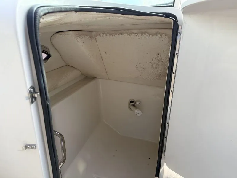 Slide: The Image of Interior view of 2005 Sea Ray 240 Sundeck storage compartment. - 19