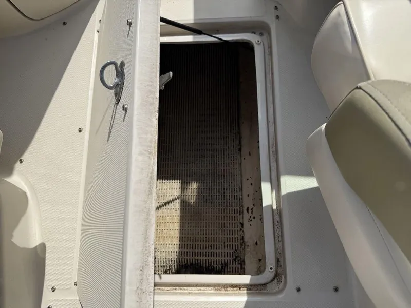 Slide: The Image of Open storage compartment on a 2005 Sea Ray 240 Sundeck boat. - 28