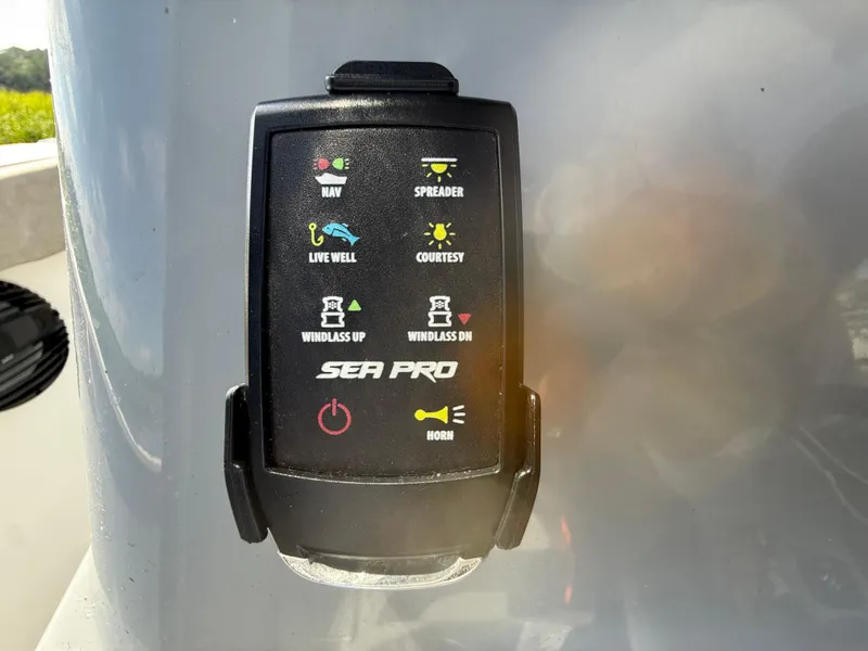 Slide: The Image of Control panel of 2024 Sea Pro 262DLX boat with various function buttons. - 13