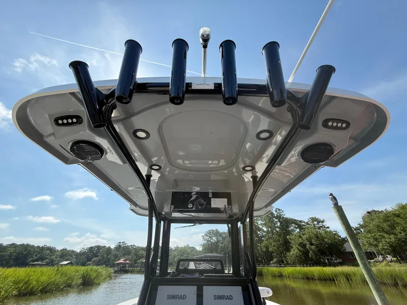 Slide: The Image of 2024 Sea Pro 262DLX boat with rod holders and electronics, viewed from below. - 28