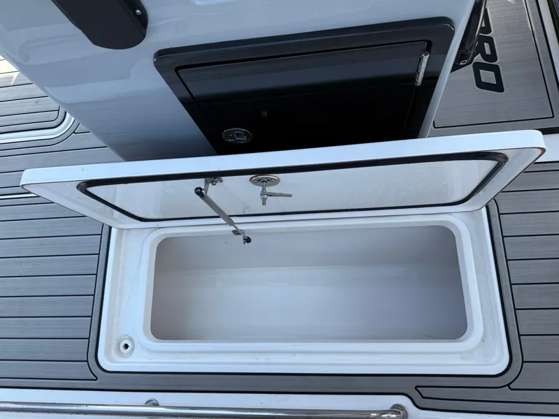 Slide: The Image of Open storage compartment on 2024 Sea Pro 262DLX boat deck. - 38