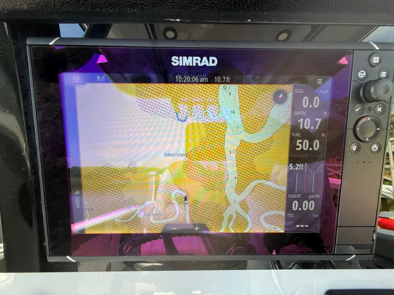 Slide: The Image of Simrad navigation display on 2024 Sea Pro 262DLX showing Edisto Island map and boat metrics. - 7