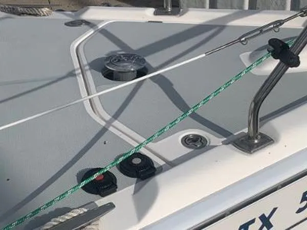 Slide: The Image of Deck of 2008 Hunter 33 sailboat with rigging and cleats visible. - 10