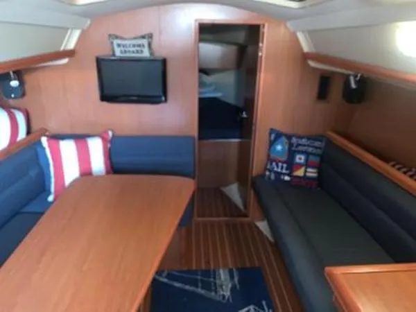 Slide: The Image of Interior of 2008 Hunter 33 sailboat with cozy seating and nautical decor. - 13