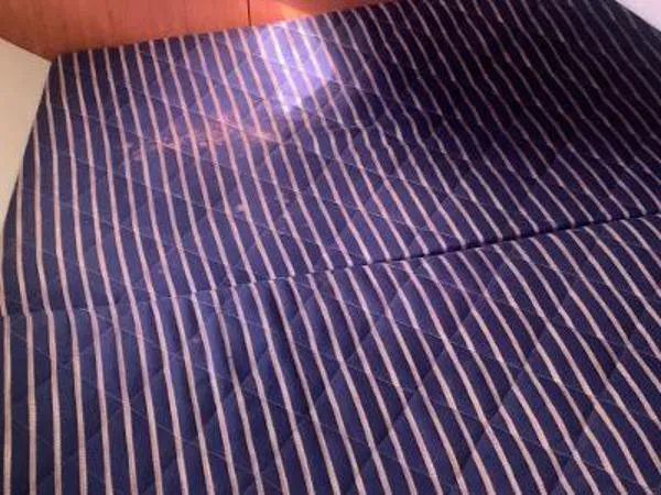 Slide: The Image of Striped mattress in a 2008 Hunter 33 boat cabin. - 18