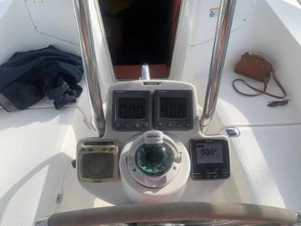 Slide: The Image of Cockpit of 2008 Hunter 33 sailboat with navigation instruments and compass. - 6