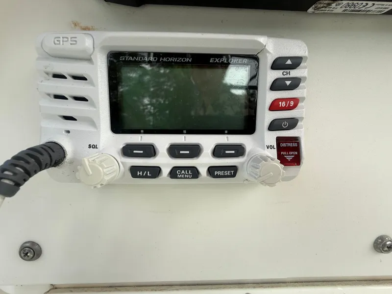 Slide: The Image of Standard Horizon Explorer marine radio on 2002 Contender 27 Tournament boat dashboard. - 15