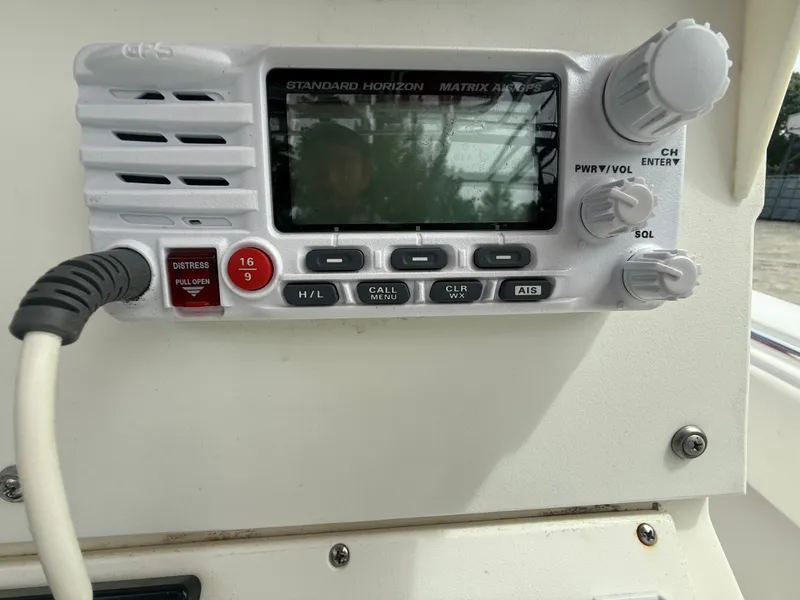 Slide: The Image of Standard Horizon Matrix AIS/GPS radio on 2002 Contender 27 Tournament boat dashboard. - 16