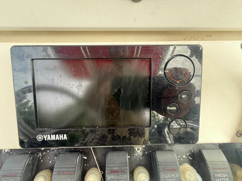 Slide: The Image of Yamaha control panel on 2002 Contender 27 Tournament boat dashboard. - 17
