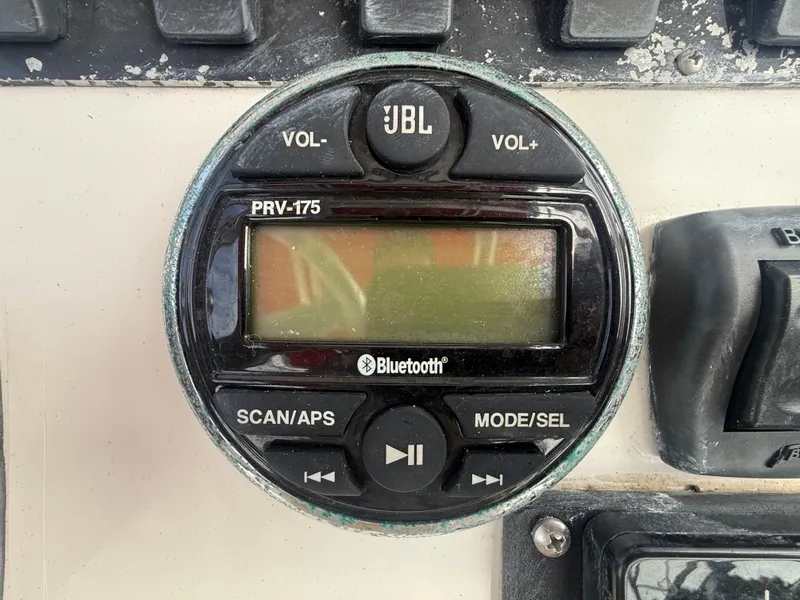 Slide: The Image of JBL PRV-175 Bluetooth stereo on 2002 Contender 27 Tournament boat dashboard. - 18