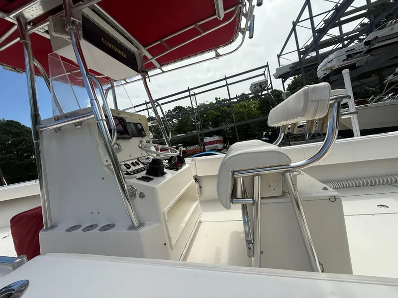 Slide: The Image of 2002 Contender 27 Tournament boat interior with steering console and seating. - 3