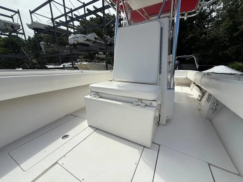 Slide: The Image of 2002 Contender 27 Tournament boat interior with seating and storage. - 9