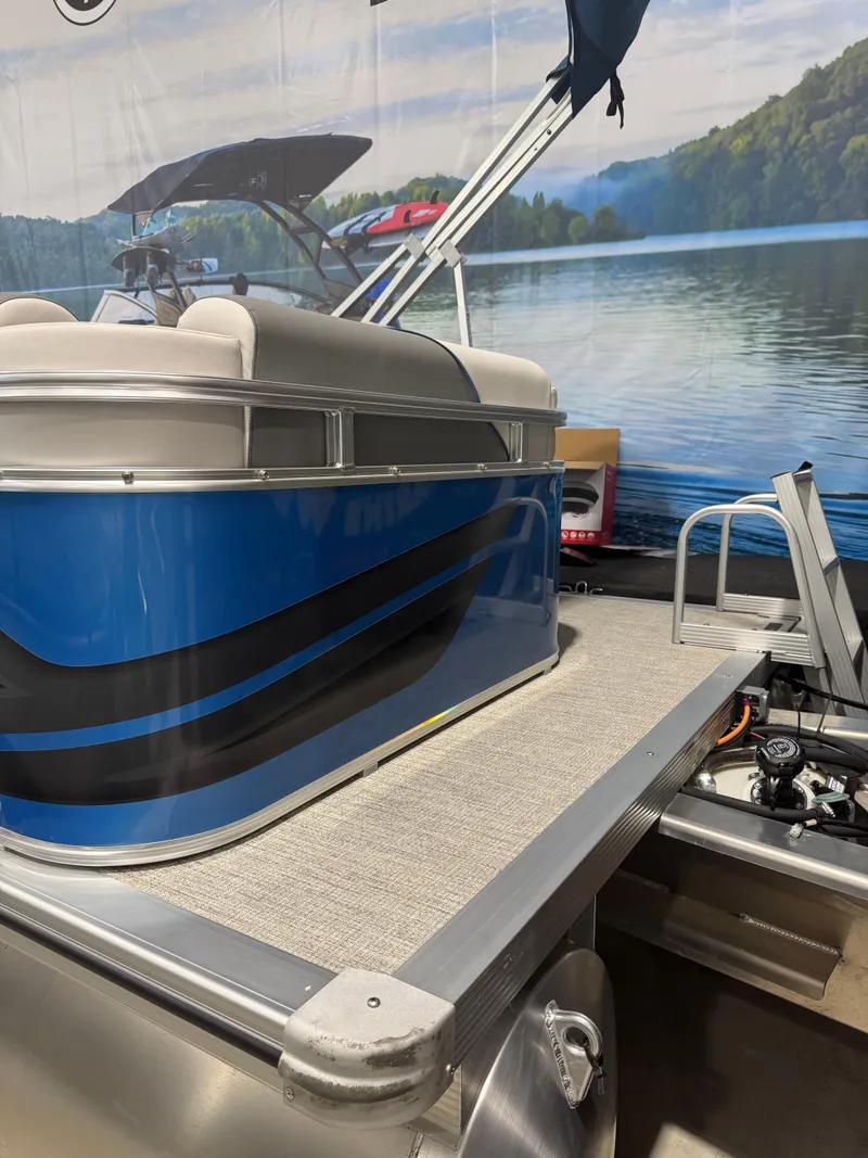 Slide: The Image of 2024 Avalon 1575 23 Venture CR pontoon boat with blue and black design. - 12