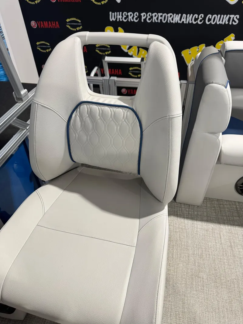 Slide: The Image of 2024 Avalon 1575 23 Venture CR boat seat with white upholstery and blue accents. - 9