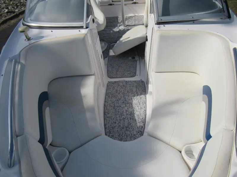 Slide: The Image of 2004 Yamaha Boats SX230 interior seating and cockpit area. - 23