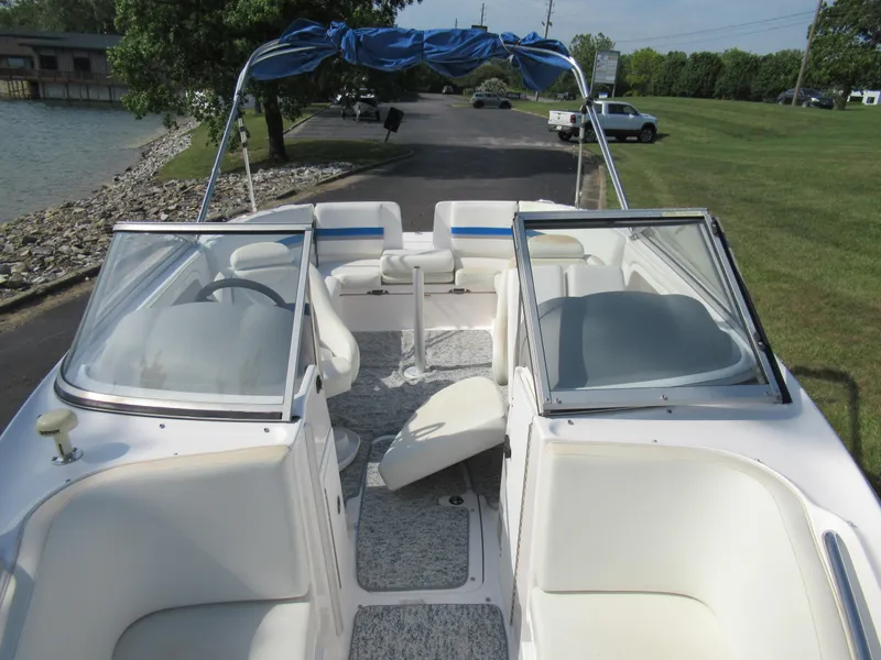 Slide: The Image of 2004 Yamaha Boats SX230 interior with seating and windshield. - 24