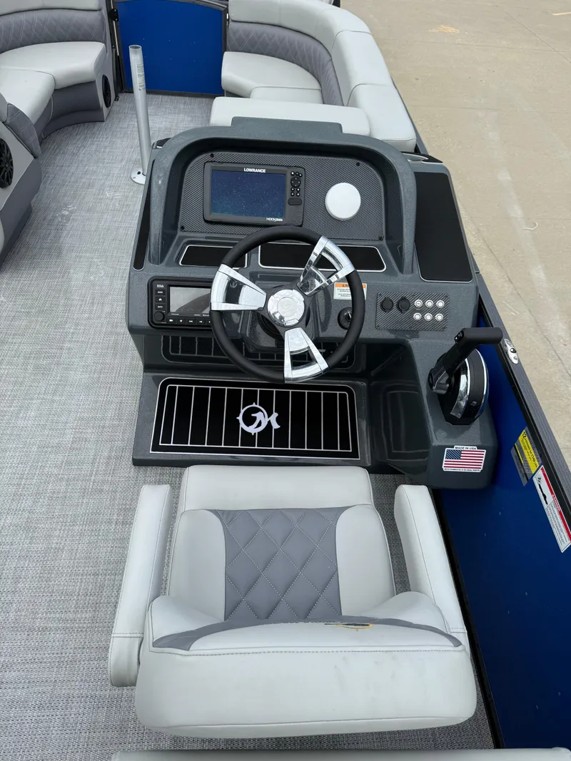 Slide: The Image of 2024 Massimo Marine P 24 LIMITED QUAD boat interior with steering console and seating. - 10
