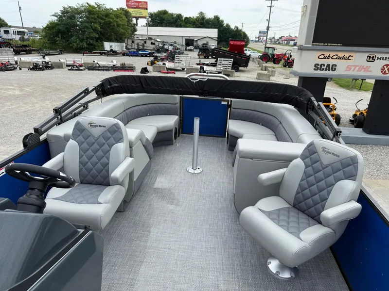 Slide: The Image of 2024 Massimo Marine P 24 LIMITED QUAD boat interior with gray seating and steering wheel. - 8
