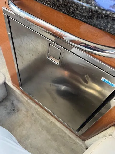 Slide: The Image of Stainless steel refrigerator in 2008 Chaparral Signature 250 boat interior. - 16