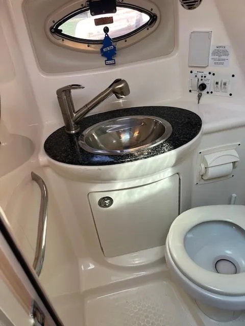 Slide: The Image of 2008 Chaparral Signature 250 boat bathroom with sink and toilet. - 18