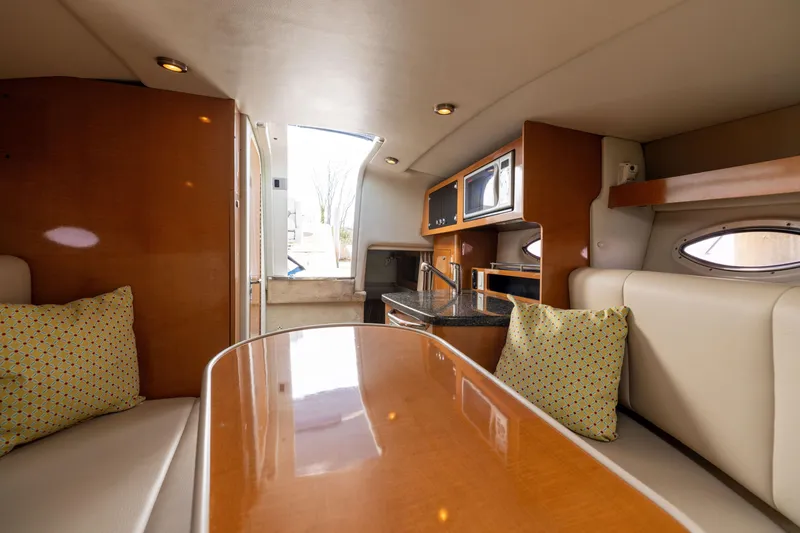 Slide: The Image of Interior of 2008 Chaparral Signature 250 boat with kitchenette and seating area. - 19
