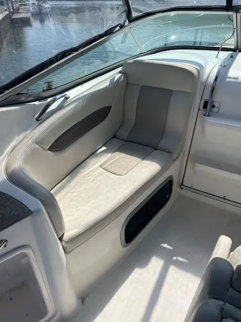 Slide: The Image of 2008 Chaparral Signature 250 boat interior with cushioned seating and sleek design. - 6