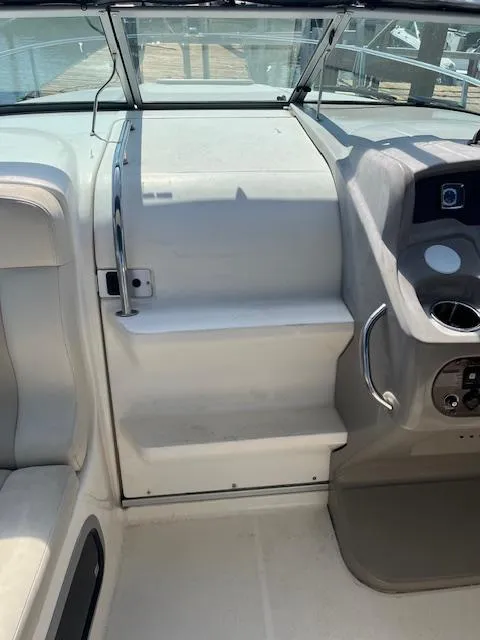 Slide: The Image of 2008 Chaparral Signature 250 boat interior with seating and control panel. - 8