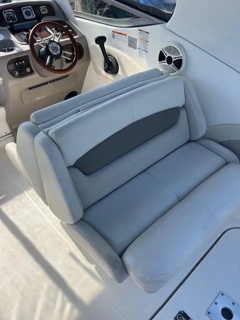 Slide: The Image of 2008 Chaparral Signature 250 boat interior with steering wheel and cushioned seating. - 9