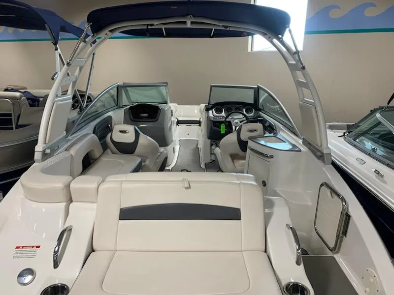 Slide: The Image of 2018 Chaparral 224 Sunesta boat interior with seating and dashboard. - 3